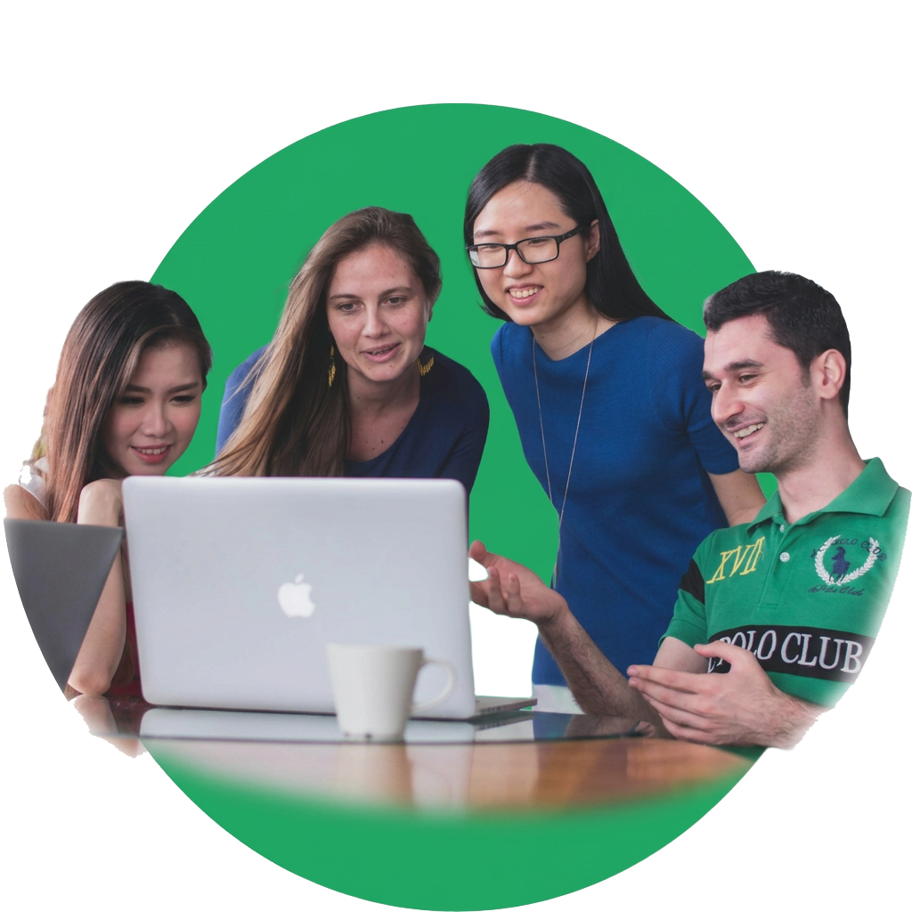 Team collaborating around a laptop