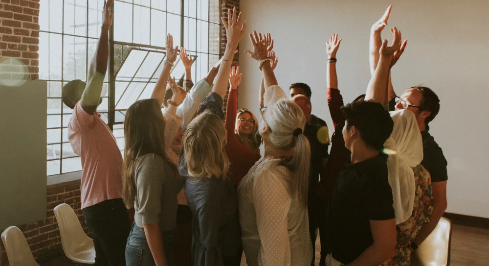 A community of people joining hands in teamwork
