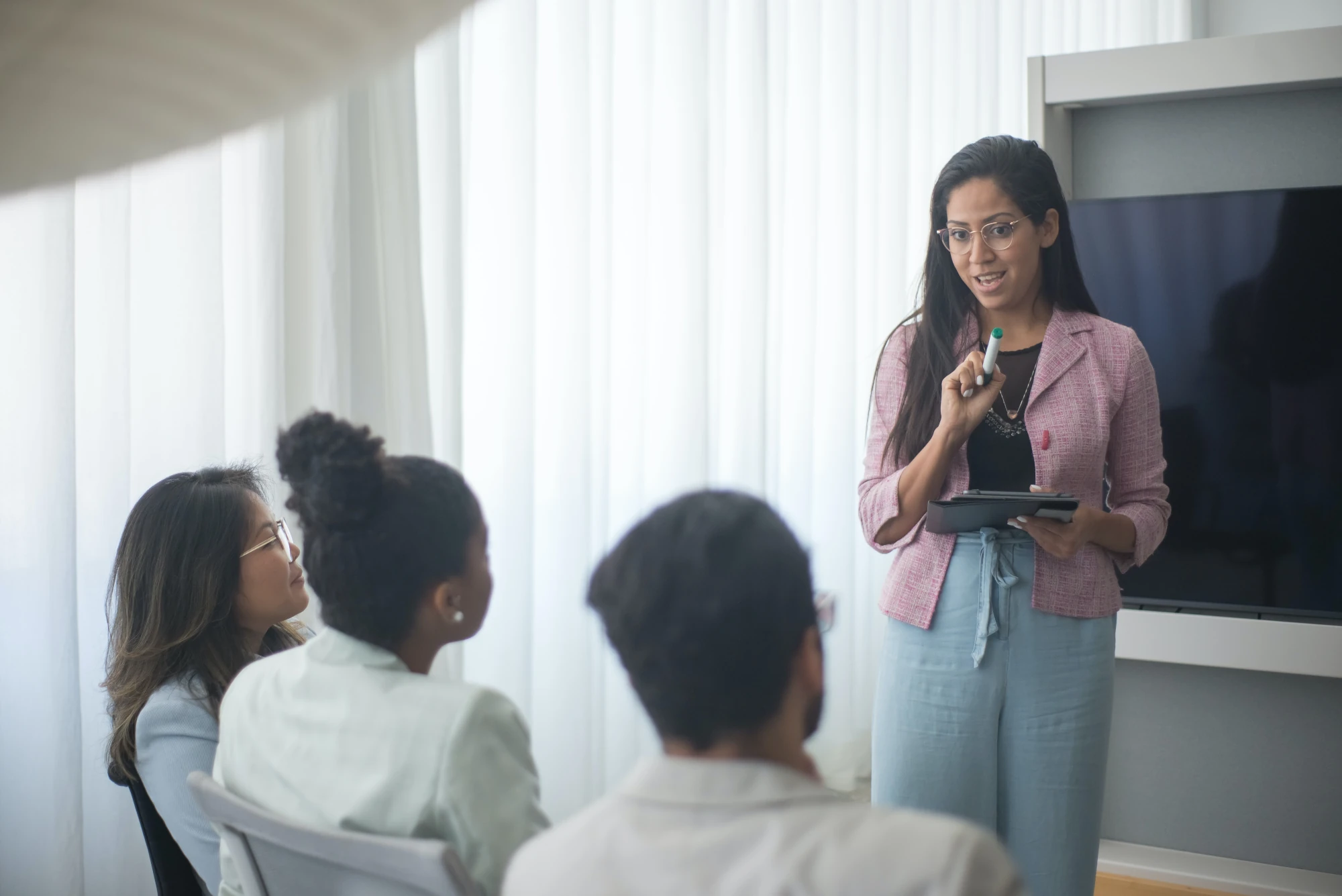 A Prepr facilitator presenting to a small group during an info session