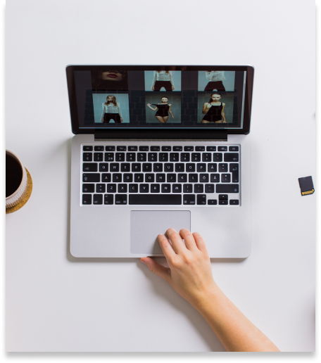 A person building a portfolio on a laptop