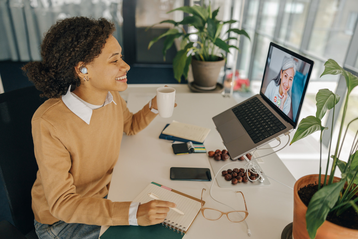 Business professional in a video conference with her team