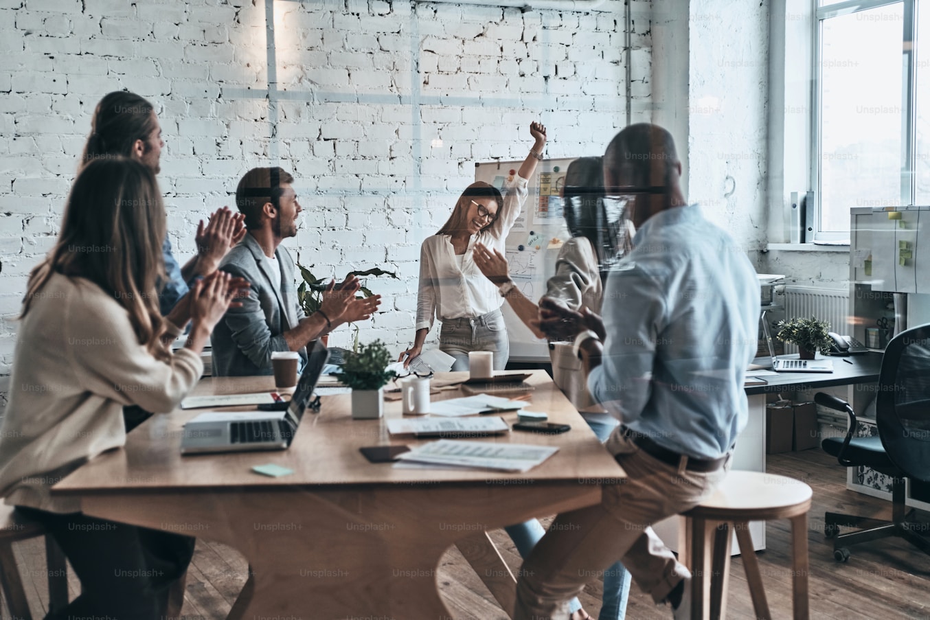 Team collaborating on AI training in a modern workplace