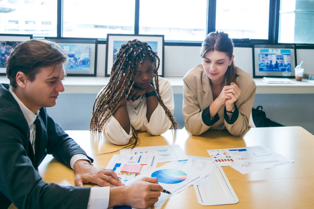 A team analyzing data charts and analytics together
