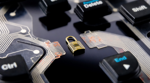 Photo: padlock on circuit board representing cybersecurity.